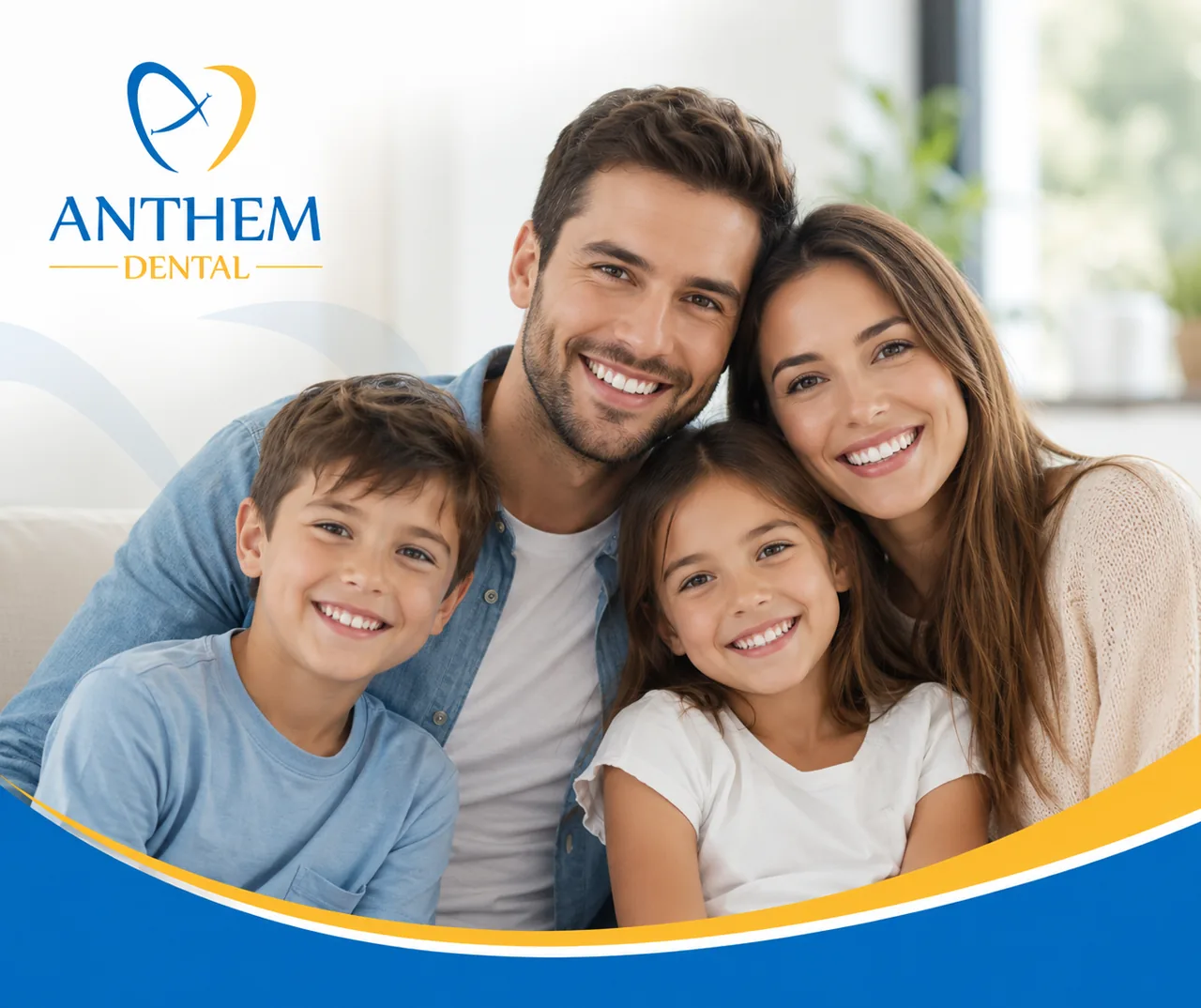 A smiling family of four relaxing together on a couch